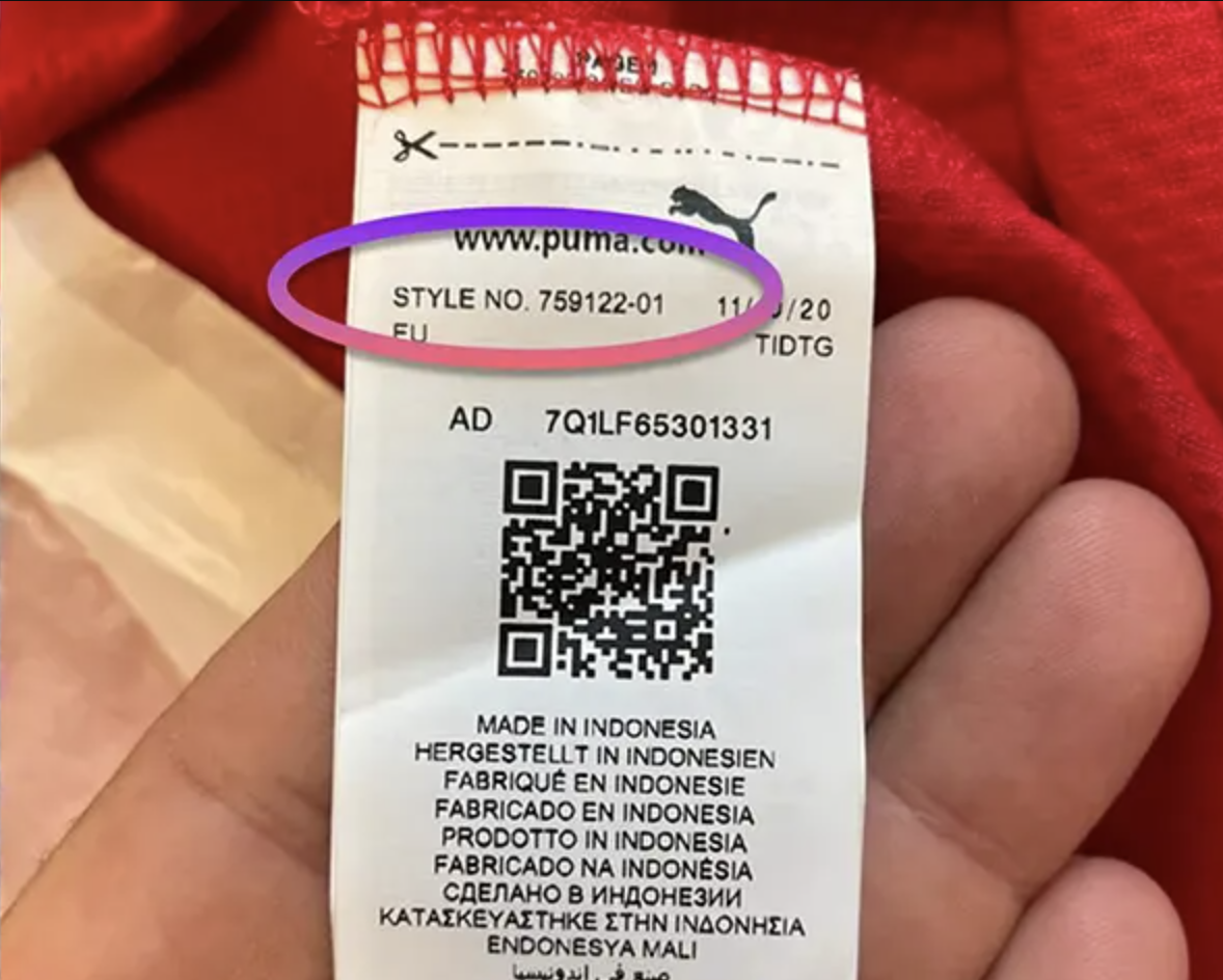 PUMA shirt with the long wash-care ribbon unfolded flat inside the hem